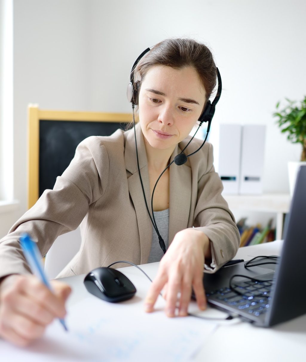young-woman-is-learning-language-with-laptop-computer-camcorder-and-headphone-online-at-home-.jpg
